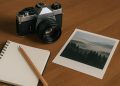 Camera and sketchbook on a designer’s desk highlighting the link between photography and design